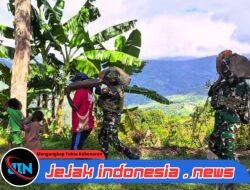 Satgas Pamtas RI-PNG Kewilayahan Yonif 521/DY Gelar Gotong Royong Bersama Warga Distrik Eragayam