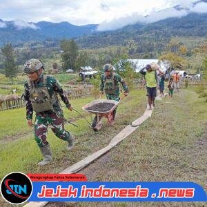 Satgas Yonif 700/WYC Gelorakan Semangat Kebersamaan: Pos Bendungan Bantu Pembangunan Patung Misionaris Gordon F. Larson