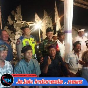 Bhabinkamtibmas Desa Bakas Bersama Tiga Pilar Amankan HUT Sekaa Teruna Putra Bhakti.